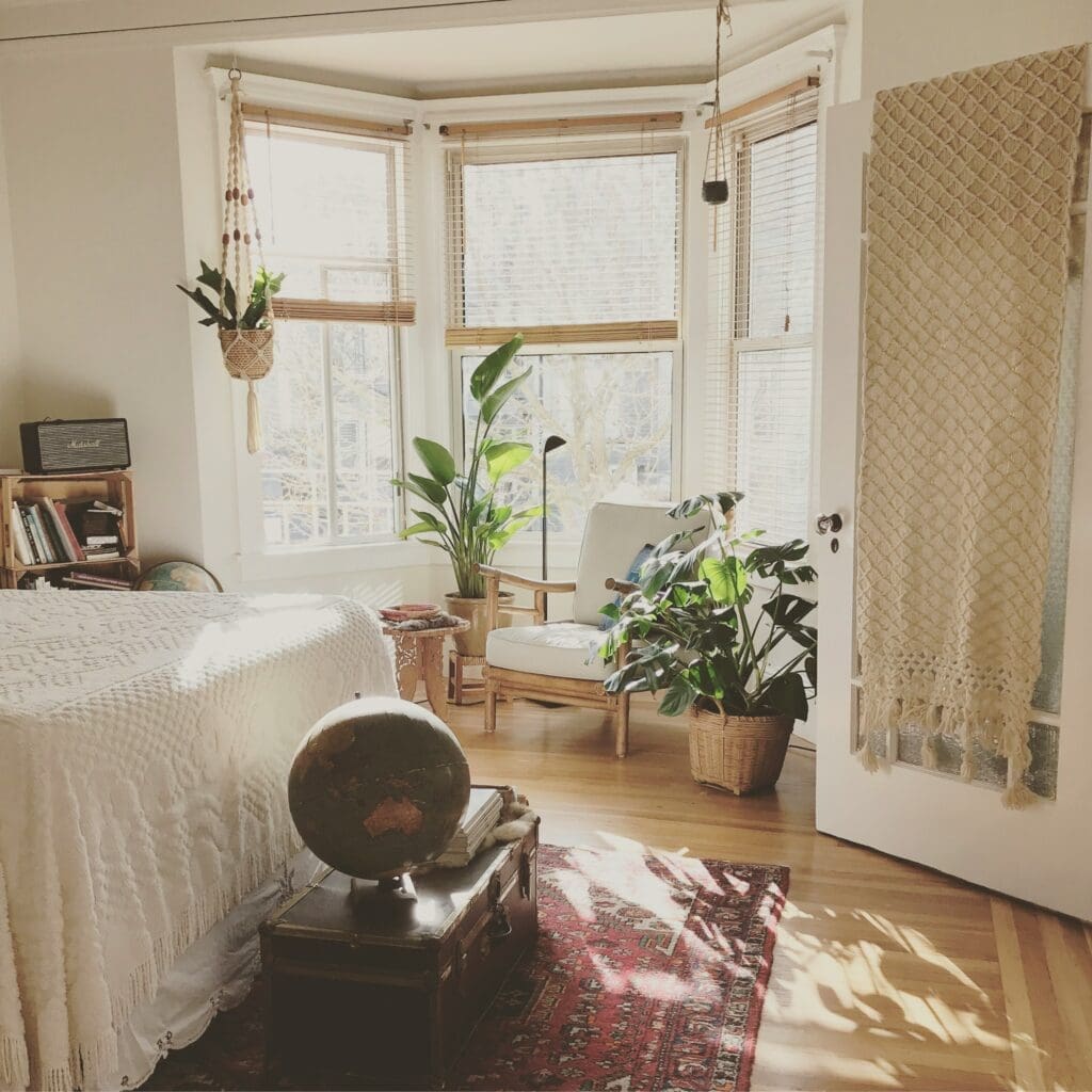 A cozy corner sofa in the bedroom, perfectly placed by the window with natural light streaming through, creating a warm and inviting space. With our lease-to-own option, you can enjoy the comfort of this home while you build equity from day one, making homeownership more accessible and rewarding.